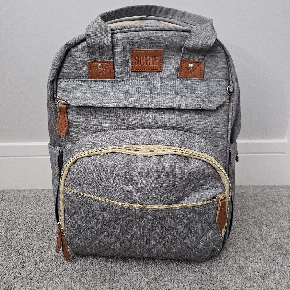 Diaper bag with built in changing station